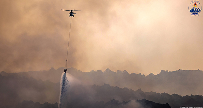 Rental helicopter firefighting forest fires or heavy lifting - Wildfire helicopter Super Puma bambi bucket equipment - Fire attack heavy helicopter super puma firefighting solution HM - Wildfire civil protection Putting out fires by helicopter